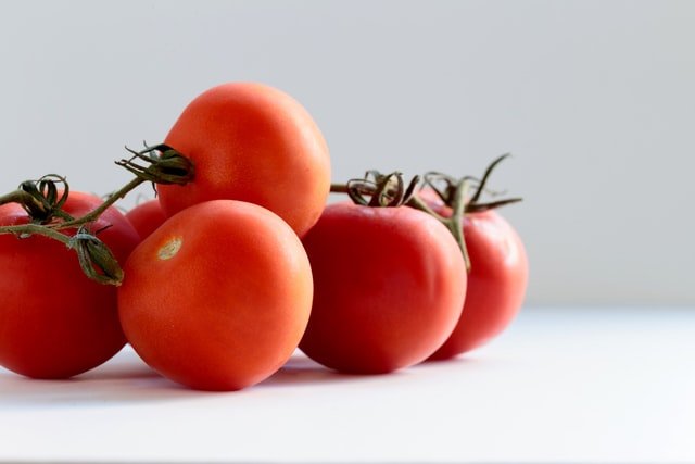 Tomatoes on the white floor