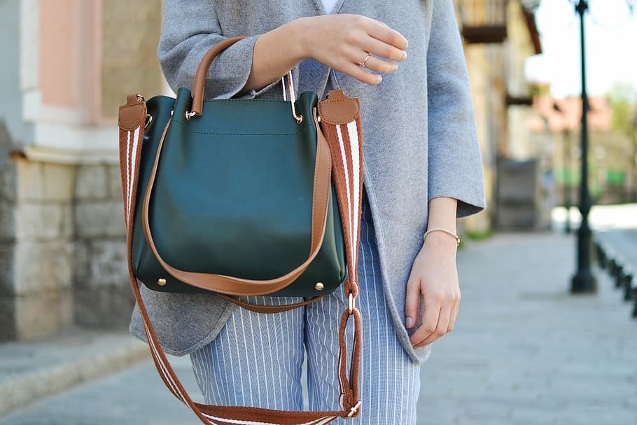 women holding a hand bag