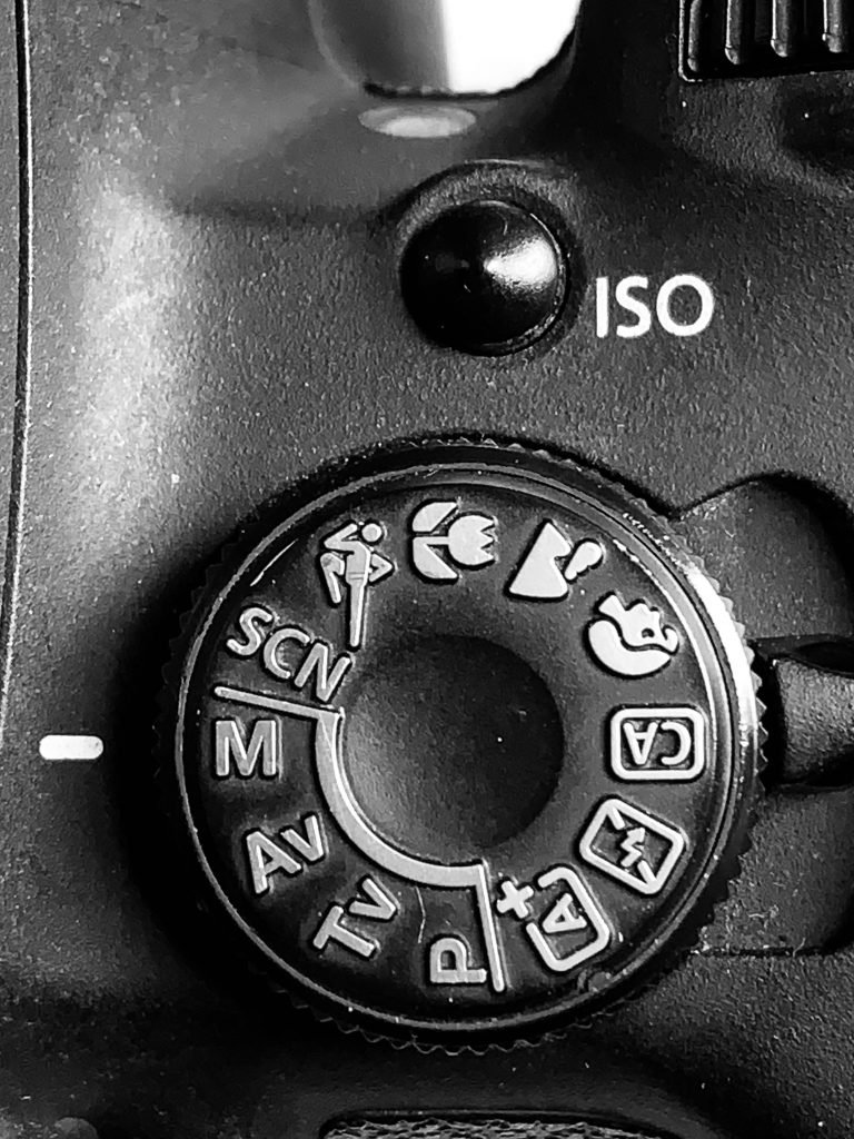The picture depicts the mode wheel of the camera.