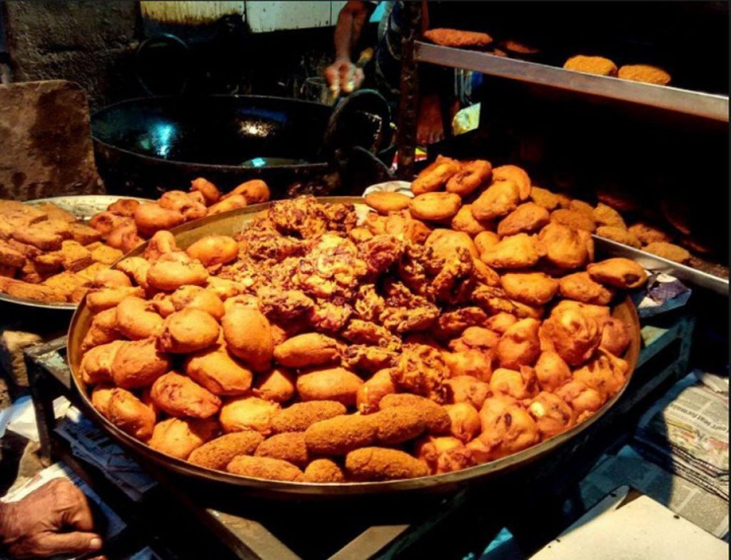 Telebhaja is a broad term and consists of all types of chops and fries. It is a deep fried evening snack served with Kashundi ( a type of sause), ketchup and salad.