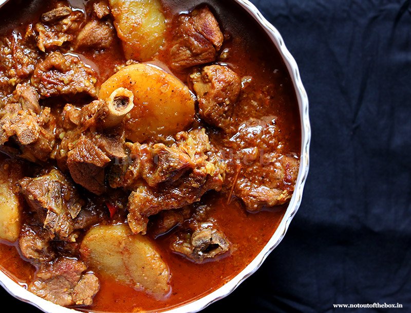This is the picture of Bengali style mutton (red meat) curry along with lots of oil and Aloo. It can be served with Plain Rice or Fried Rice, Pulao and even rotis.